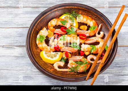 shrimp tails, stir fried in olive oil with spices, close-up Stock Photo