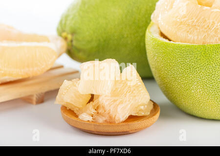 fresh and peeled pomelo(shaddock), grapefruit with slices isolated on white background Stock Photo