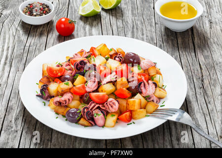 Potato salad with pickled octopus, close-up Stock Photo