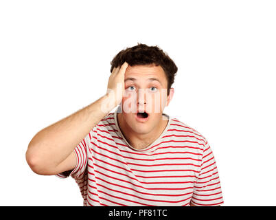 man with strong expression of fear, round eyes, open mouth and hands pressed to top of head, showing astonishment and shock. emotional guy isolated on Stock Photo
