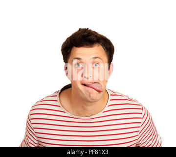 young handsome man joke disagree gesture showing tongue. emotional guy isolated on white background. Stock Photo
