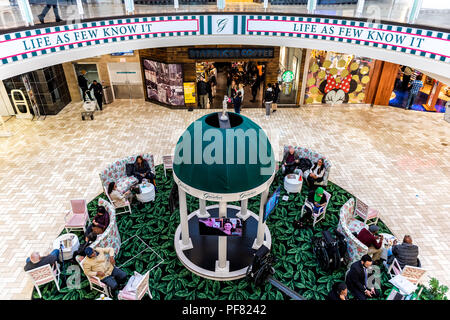 Tysons Corner, USA - January 26, 2018: High angle view on people, shoppers, customers relaxing on couches, armchairs, chairs in plaza, court of indoor Stock Photo