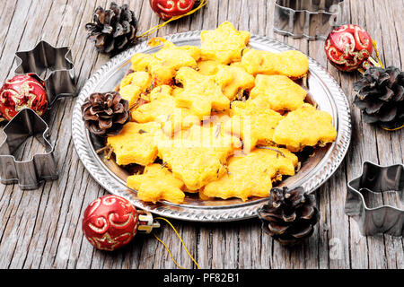 Symbolic biscuits with rosemary for Christmas. Christmas treats. Stock Photo