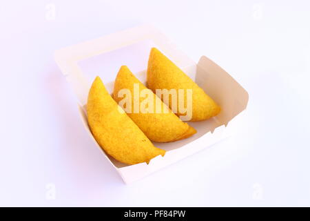 Traditional empanadas, colombian breaded wrap made by folding dough over a stuffing, which may consist of meat, cheese, or other ingredients. Stock Photo