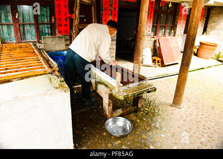 Crafts,Imbroidery,paper making,Village life,Ancient Homes,Quingman Miao Village,Shiqiao Miao Village,Guizhou,PRC,People's Republic of China,China Stock Photo