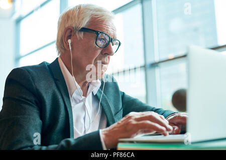 Modern Senior  Businessman Using Laptop Stock Photo