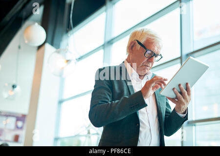 Senior  Businessman Using Tablet Stock Photo