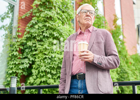 Modern Senior  Man Posing Outdoors Stock Photo