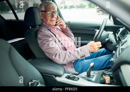 Senior Businessman in Car Stock Photo
