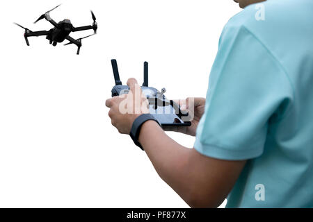 Hands of a man with radio control drone isolated on white background Stock Photo