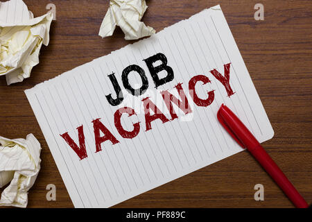 Conceptual hand writing showing Job Vacancy. Business photo text empty or available paid place in small or big company Marker over notebook crumpled p Stock Photo
