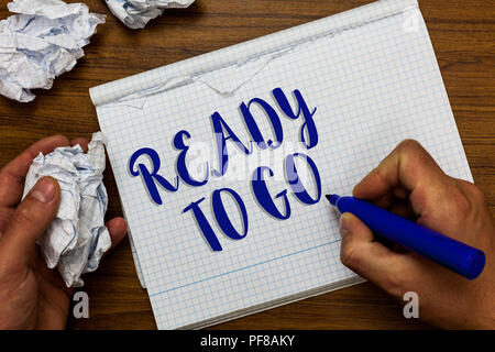 Conceptual hand writing showing Ready To Go. Business photo showcasing asking someone if he is prepared or packed his things Man holding marker notebo Stock Photo