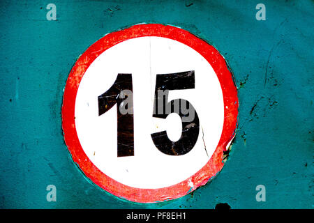 image old worn sign speed limit 15 sticker on board Stock Photo