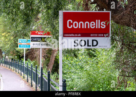 Estate agents boards in a line Stock Photo