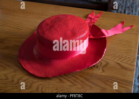 Alkmaar, Netherlands - July 20, 2018: Traditional red cheese carriers hat as a symbol of the Alkmaar guild Stock Photo