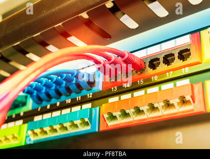 network cable connecting on network core switch close up Stock Photo