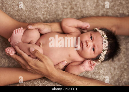 Kids care concept. Parents taking care of newborn baby Stock Photo