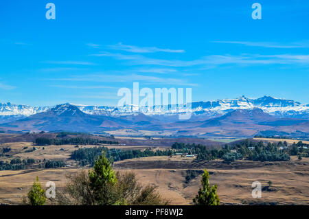Landscape of Underberg , a small countryside village with snow clad drakensberg mountains and green landscapes Stock Photo