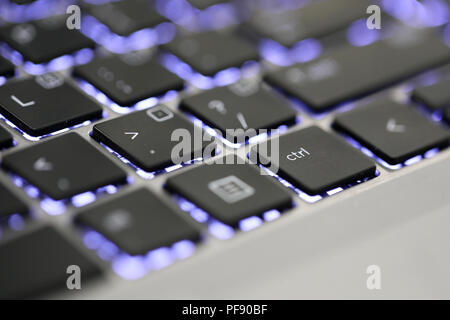 close up of the ctrl tab. The control key symbol button on an illuminated laptop computer keyboard. Stock Photo