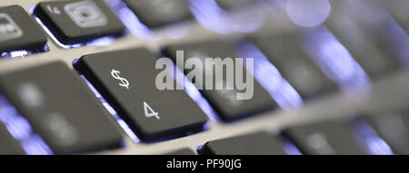 close up of the $ symbol sign on a computer laptop key board. the dollar currency tab button on a keyboard Stock Photo