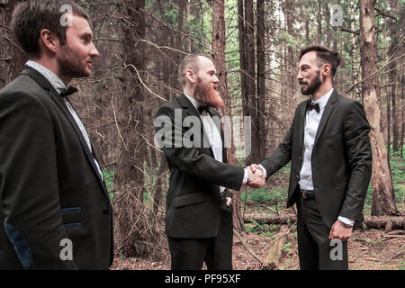 handshake business partners in an informal meeting in nature Stock Photo