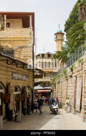 11 May 2018 Local Residents and tourists shopping on a narrow side street inear the Via Dolorosa in Jerusalem Israel. The street is lined with the goo Stock Photo