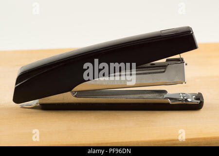 new stapler for stapling papers on a table Stock Photo