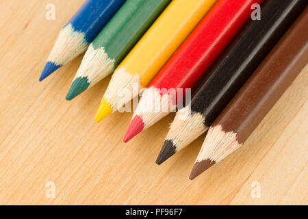 many sharp sharpened colored pencils close-up on the background Stock Photo