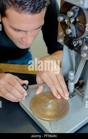 shoemaker repairs the machine Stock Photo