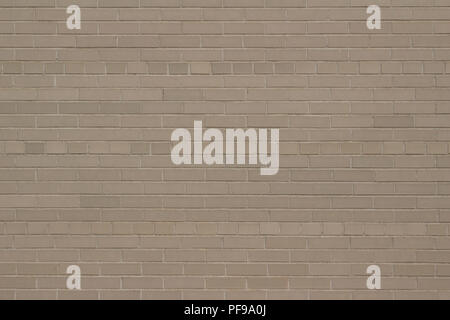 Attractive weathered light grey or beige brick wall background with a Scottish bond brickwork pattern Stock Photo