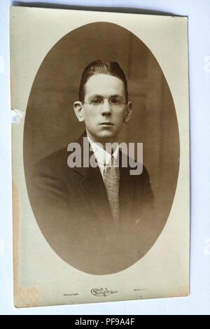 Social History - Black and white old photograph showing a portrait of a young man wearing glasses1930s / 1940s Stock Photo