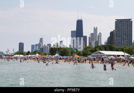 People at North Avenue Beach watch during a practice day during the 2018 Chicago Air and Water Show in Chicago, Illinois, United States of America Stock Photo