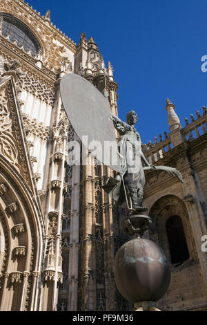 Bronze copy of 'Faith', aka Giraldillo, the weathervane on the top of Giralda Tower: this copy is in the South entrance to Seville Cathedral, Spain Stock Photo