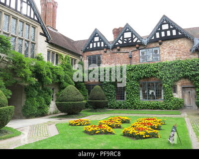 The courtyard, entrance and front of the buildings at Baddesley Clinton, a medieval moated manor house in Warwickshire; a National Trust property. Stock Photo