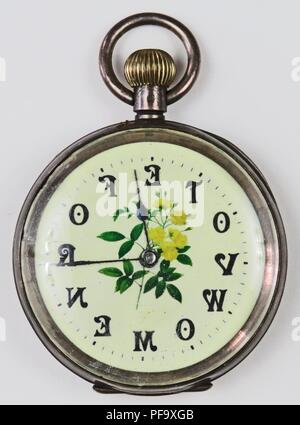 silver colored pro suffrage pocket watch or fob watch with the phrase vote for women with each letter corresponding to a numeral and a yellow and green rose on the enamel face 1900 photography by emilia van beugen