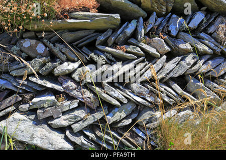 Herringbone patterned slate dry stone wall at St Materiana's Church, Tintagel, Cornwall, England, UK. Stock Photo