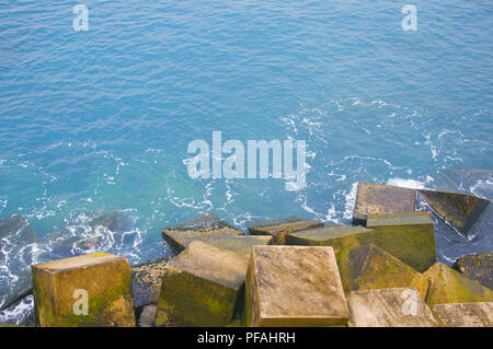 Blue ocean and cubic stones view, macro, summer Stock Photo