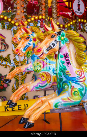 Three wooden horse on a merry-go-round Stock Photo