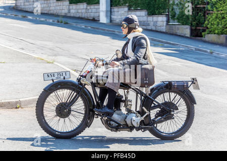 A woman in a period costume on a Veteran vintage motorbike, NSU 251 T, 1929, Czech Republic woman vintage motorcycle Stock Photo