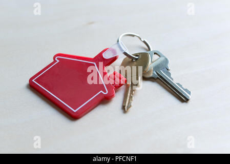 House key with red house shape keychain Stock Photo