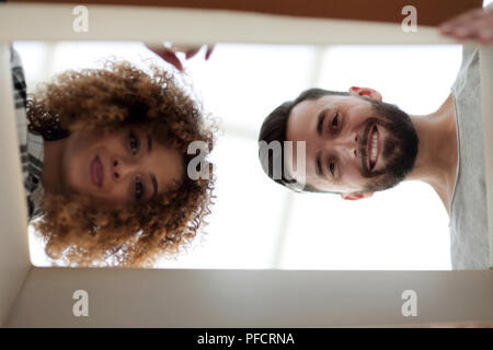 View from the bottom of the newlyweds looking inside the box. Stock Photo