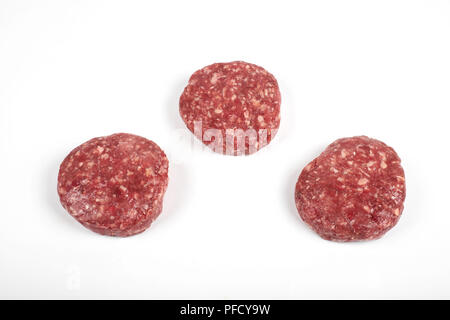 Raw fresh large beef burger or cutlets isolated on white background Stock Photo