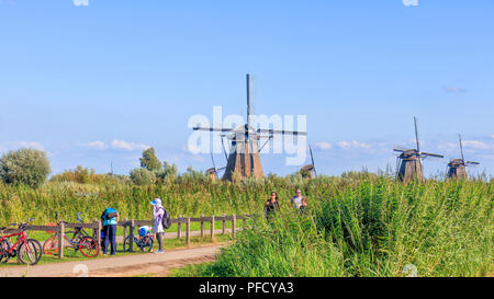 Kinderdijk, Netherlands - August 17, 2018: Tourists At Kinderdijk Stock Photo