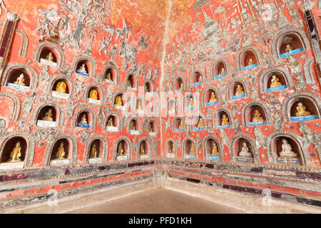 Wall with small Buddhas and leaded glass figures, Shwe Yaunghwe Kyaung Monastery, Nyaungshwe, Inle Lake, Myanmar Stock Photo
