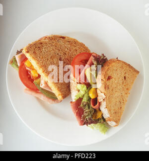 Two meat and vegetables sandwiches on a plate, close up. Stock Photo