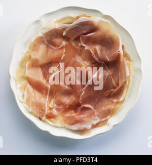 Plate of thinly-sliced parma ham, view from above Stock Photo