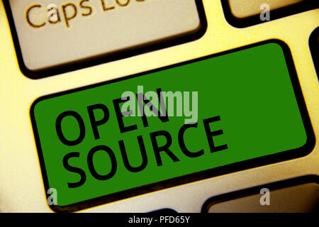 Handwriting text writing Open Source. Concept meaning denoting software which original source code freely available Keyboard green key Intention creat Stock Photo