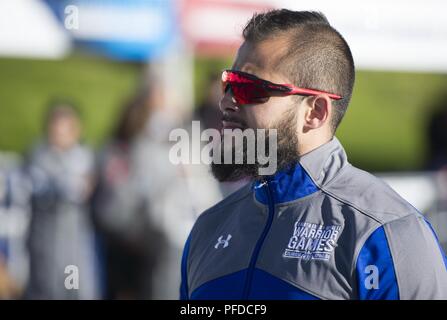 Team Air Force Veteran Rafael Morfinenciso waits for the track & field events to start, June 2, 2018, at the DoD Warrior Games. The Warrior Games, taking place June 1-9, 2018, at the U.S. Air Force Academy in Colorado, are a Paralympic-style competition for wounded, and injured service members from all U.S. branches of service and this year include teams from the United Kingdom Armed Forces, Australian Defence Force and Canadian Armed Forces. Stock Photo