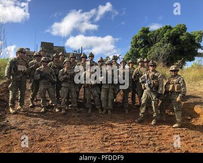 U.S. Marines Lt. Col. Warren C. Cook, Commanding Officer and SgtMaj Jose H. Molina, Sergeant Major for 2nd Battalion 4th Marines take a photo with Weapons Platoon while visiting Company F at Shoal Water Bay Training Area during Diamond Strike on May 30, 2018. Diamond Strike is a culmination training event at the regimental level for the Australian Army to be able to deploy. Stock Photo