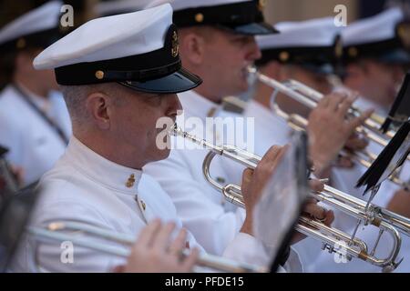 WASHINGTON (June 5, 2018) Chief Musician Stanley Curtis, trumpet instrumentalist with the U.S. Navy Ceremonial band performs at the U.S. Navy Memorial in Washington, D.C., during the commemoration of the 76th anniversary of the Battle of Midway. The Battle of Midway began on June 4 in 1942 and stands as one of the U.S. Navy's most historically significant naval battles. Fought on the high seas of the Pacific more than half a century ago, this battle altered the course of the war in the Pacific and thereby shaped the outcome of world events. Stock Photo